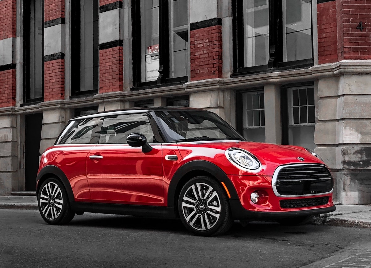 red mini cooper on the street with
